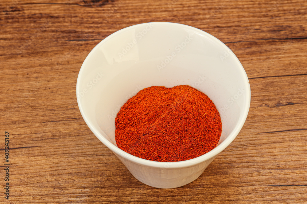 Dry paprika powder in the bowl Dry paprika powder in the bowl