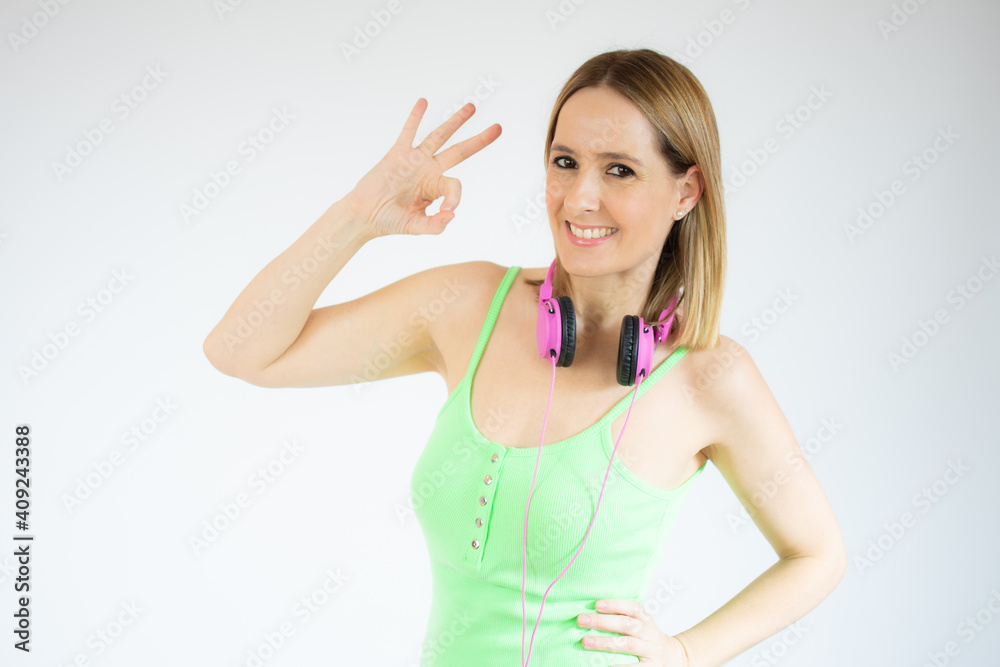 Happy young woman showing okay sign with fingers isolated over white background Happy young woman showing okay sign with fingers isolated over white background