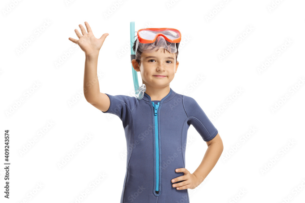 Kid wearing a wetsuit, diving mask and flippers and waving at the camera Kid wearing a wetsuit, diving mask and flippers and waving at the camera