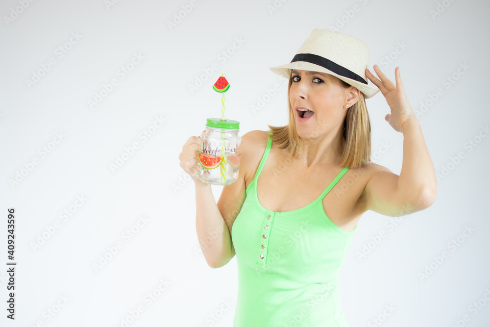 Portrait of gorgeous vacation woman wearing straw hat smiling and holding cold drink isolated over white background. Portrait of gorgeous vacation woman wearing straw hat smiling and holding cold drink isolated over white background.