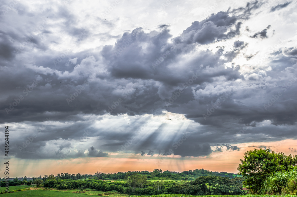 rural landscape. rainy clouds in the sky rural landscape. rainy clouds in the sky