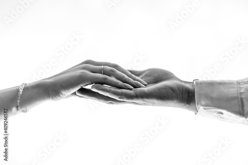 guy and a girl stretch out their hands to each other