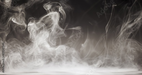 Smoke cloud whirling against dark background slow motion footage
