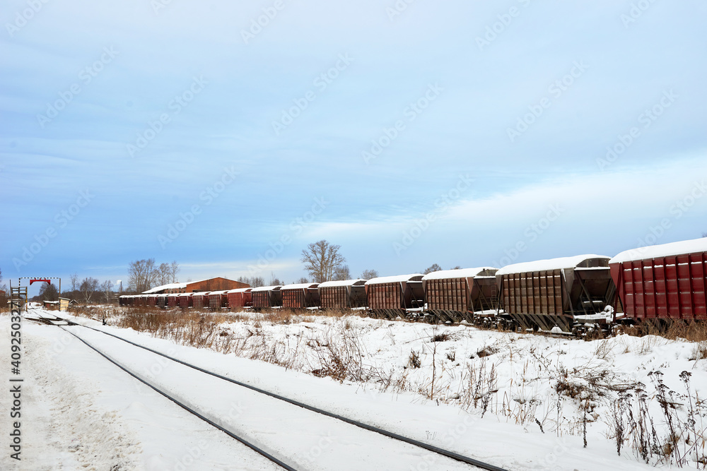 Railroad tracks in winter time. Railway infrastructure. Steel railway for trains in snow