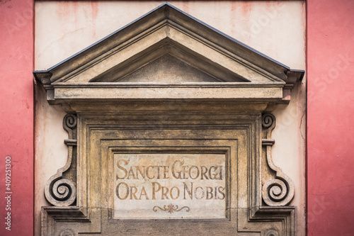 Inscription Sancte Georgi Ora pro Nobis above the Entrance to Saint Georges Basilica in Prague photo