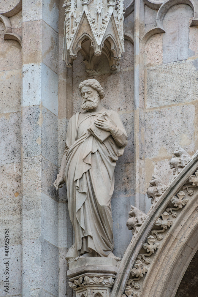Religious scenes in wall sculptures of Votive Church in the historical and touristic downtown in Vienna, Austria Religious scenes in wall sculptures of Votive Church in the historical and touristic downtown in Vienna, Austria