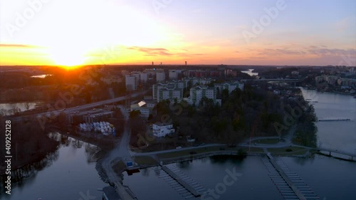 Sunset over city suburb of Bergshamra in Stockholm next water, Sweden