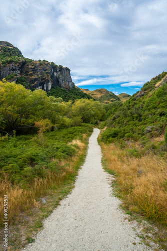 Trail amidst grassy field at Diamond Lake Conservation Area, New Zealand photo