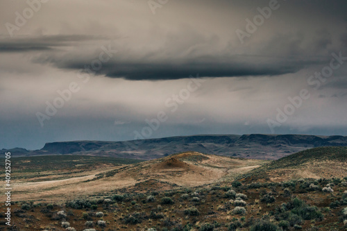 Dark clouds above an empty landscape in Owhyee, Oregon. photo