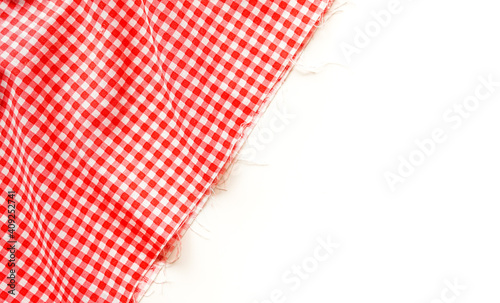 crumble pink plaid fabric or tablecloth on white background with copy space. 