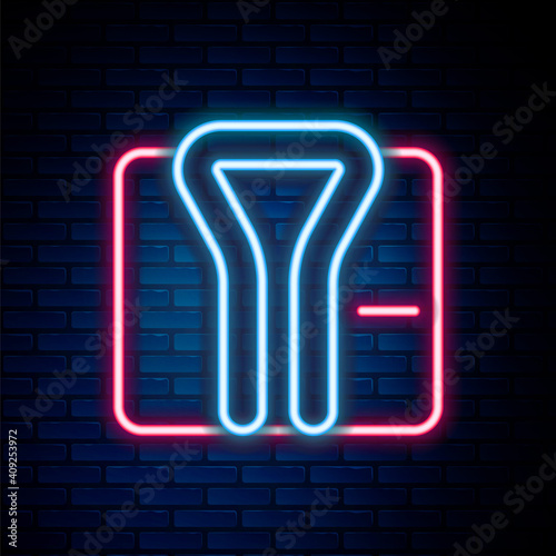 Glowing neon line Bathrobe icon isolated on brick wall background. Colorful outline concept. Vector.