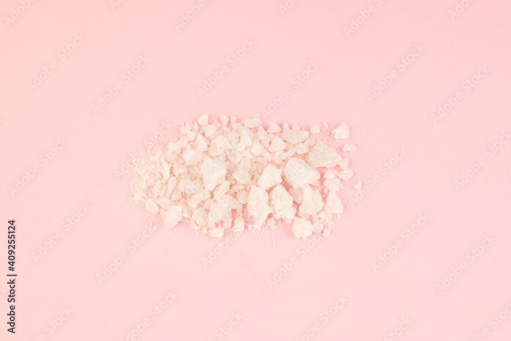Some kitchen food crystal powder with pink background Some kitchen food crystal powder with pink background