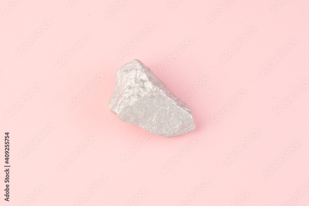 Rock on pink background top view Rock on pink background top view