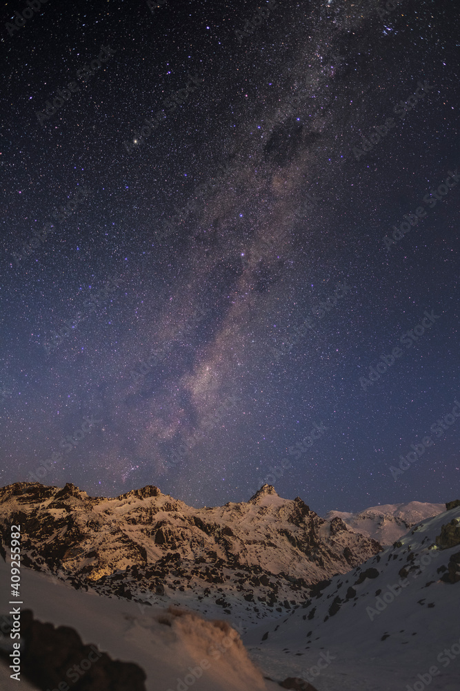 Milky Way above the illuminated mountain peaks at Whakapapa Ski Field, New Zealand Milky Way above the illuminated mountain peaks at Whakapapa Ski Field, New Zealand