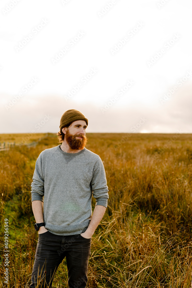 Bearded man in the english countryside at sunset Bearded man in the english countryside at sunset