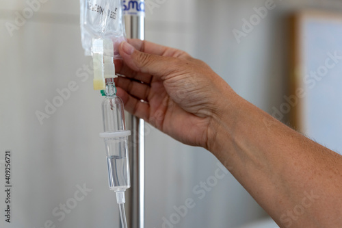 a caregiver checks an infusion photo