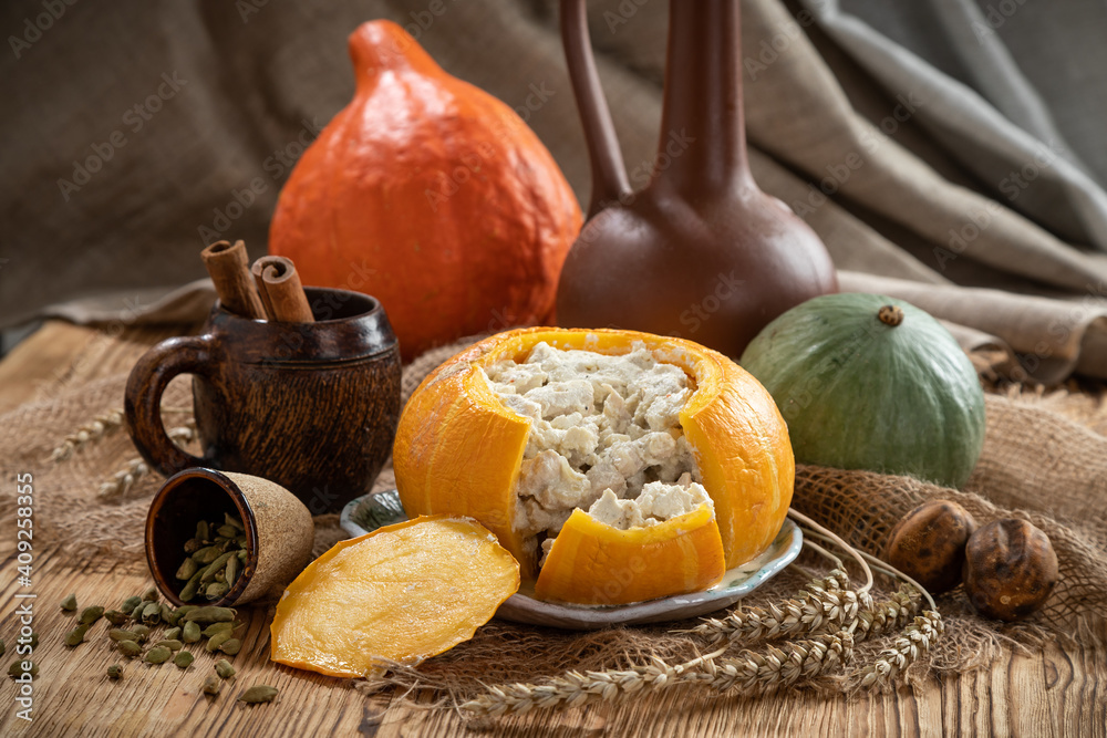 Still life with baked stuffed pumpkin