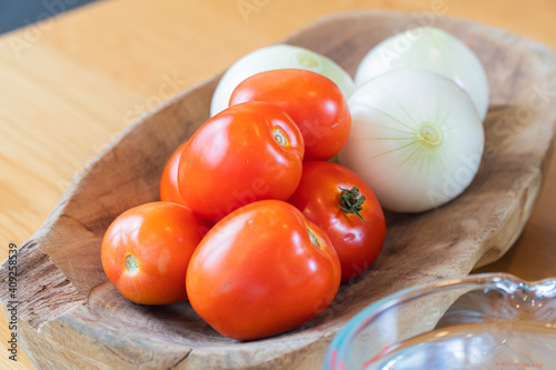 tomatoes and onion on a close-up table top