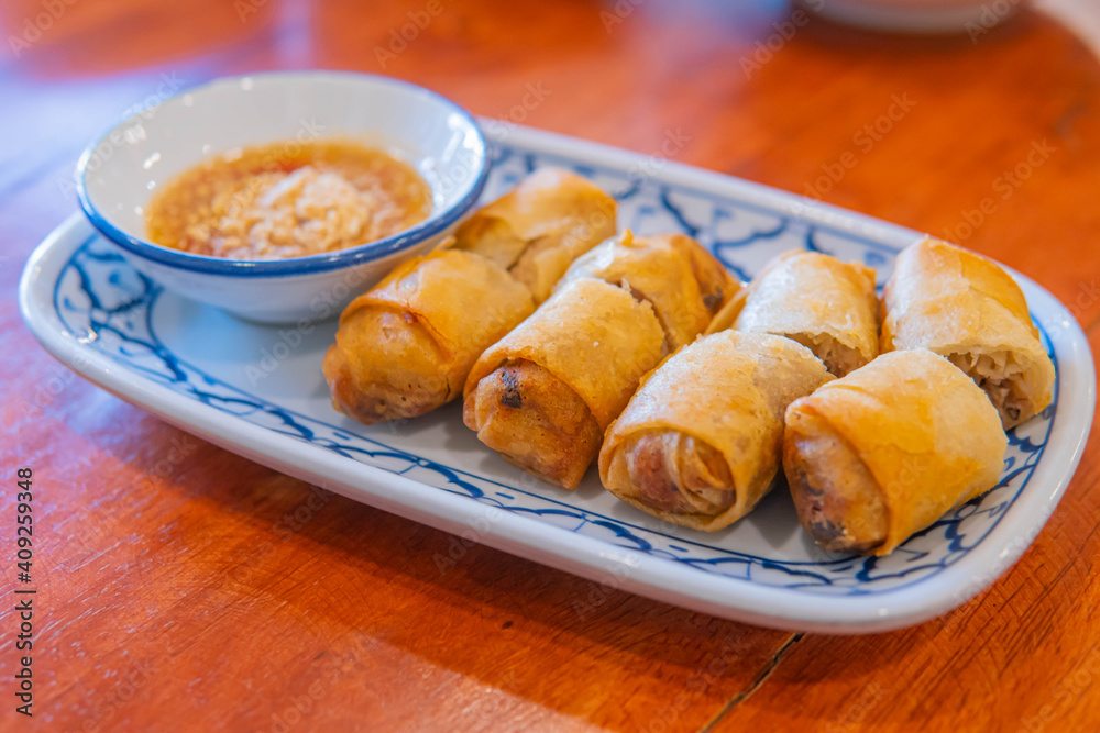 Fried chinese spring rolls with sweet chili sauce. Fried chinese spring rolls with sweet chili sauce.