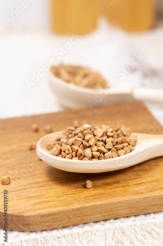 buckwheat macro view on rustic background. gluten free ancient grain for healthy diet. vertical photo