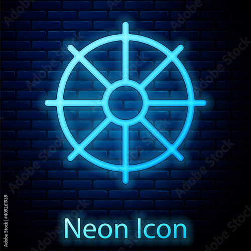 Glowing neon Dharma wheel icon isolated on brick wall background. Buddhism religion sign. Dharmachakra symbol. Vector.