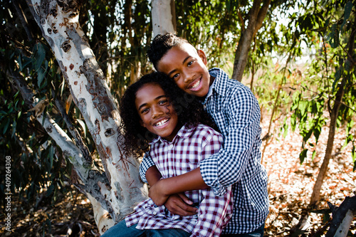 Brothers Embracing & Smiling for Camera at Park in Chula Vista photo