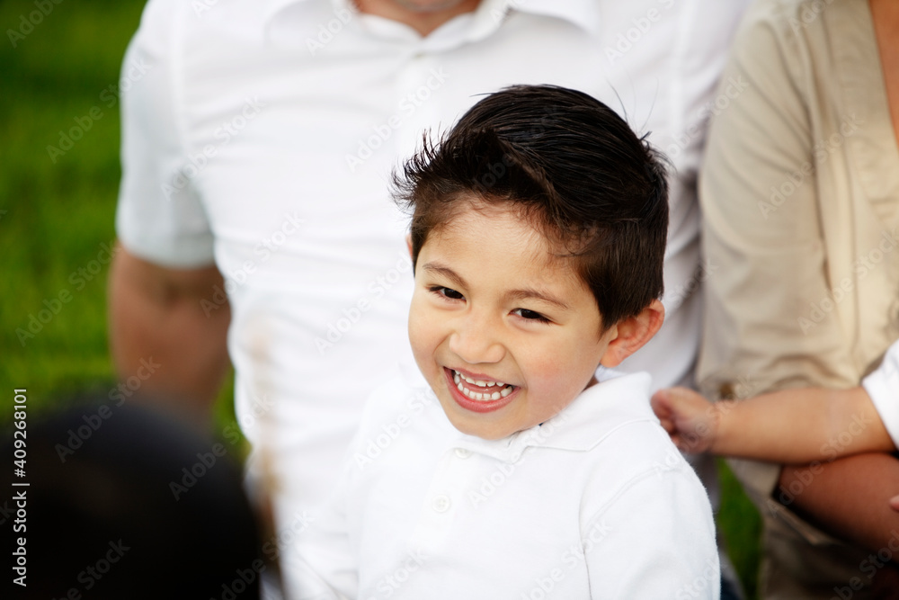 Closeup of young boy smiling while in father's arms Closeup of young boy smiling while in father's arms
