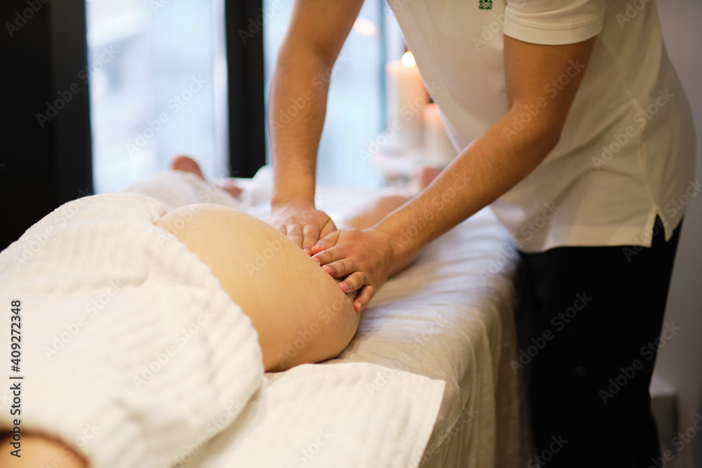 masseur makes anticellulite massage young woman in the spa salon. Body care concept. Special anticellulite treatment. masseur makes anticellulite massage young woman in the spa salon. Body care concept. Special anticellulite treatment.