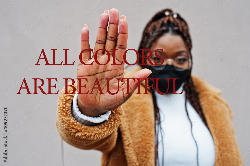 All colors are beautiful. African american woman, wear black face mask show stop hand sign. All colors are beautiful. African american woman, wear black face mask show stop hand sign.