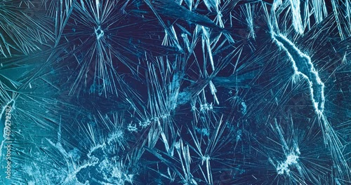 Winter background - Frost pattern on the glass. photo