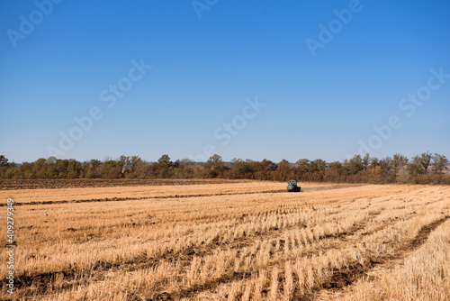 Farmer preparing his field in a tractor ready for spring.
