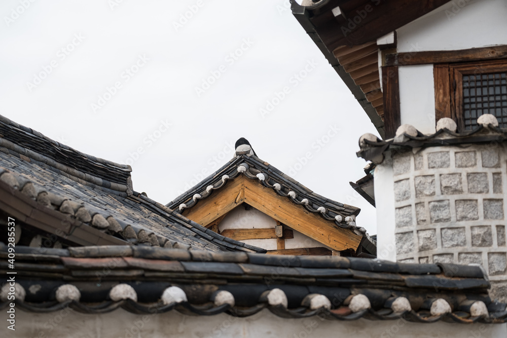Bukchon Hanok Village, a Korean traditional village with view of Namsan Tower in Seoul, South Korea.