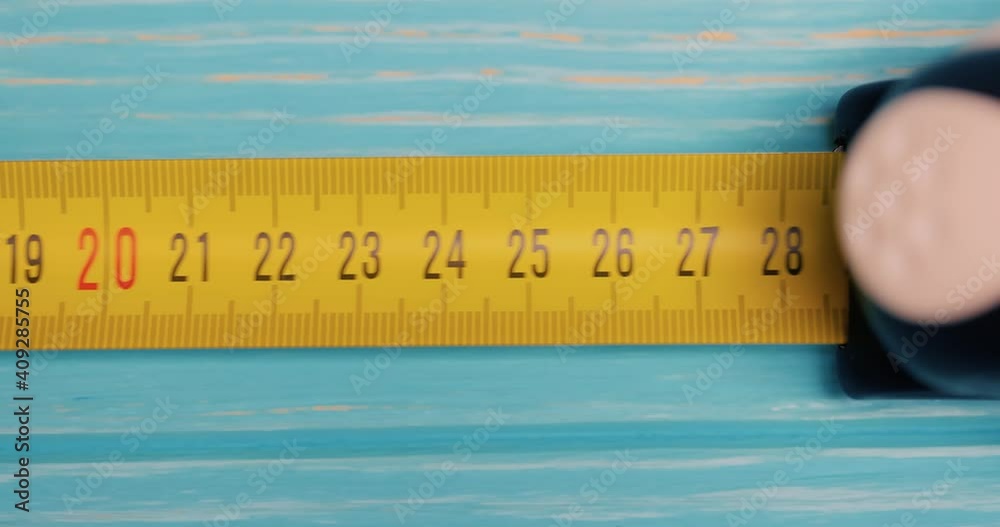 Roll of measuring tape in motion macro