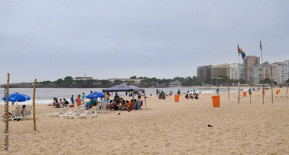 Citizens swim and sunbathe on the beach of Copacabana Citizens swim and sunbathe on the beach of Copacabana