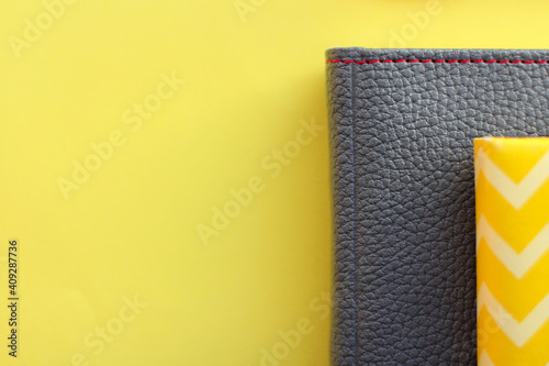 gray leather diary on a yellow background. the concept of planning. Color of the Year 2021.