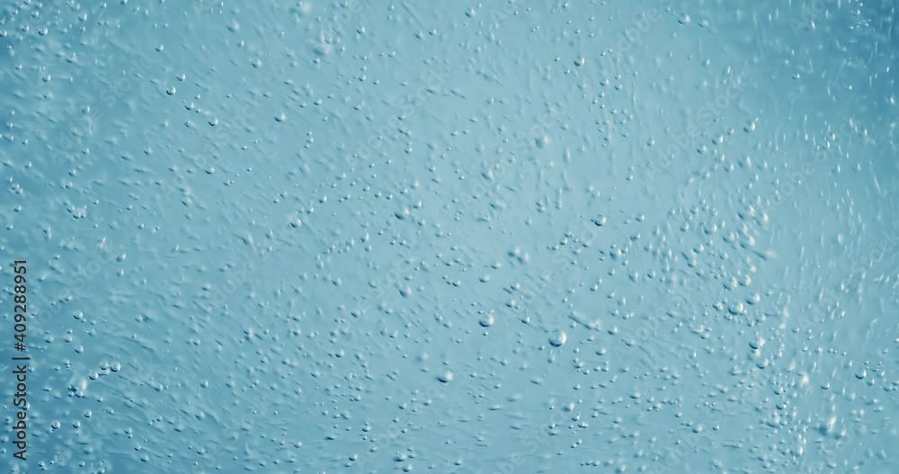 Oxygen bubbles in water on a blue abstract background Oxygen bubbles in water on a blue abstract background