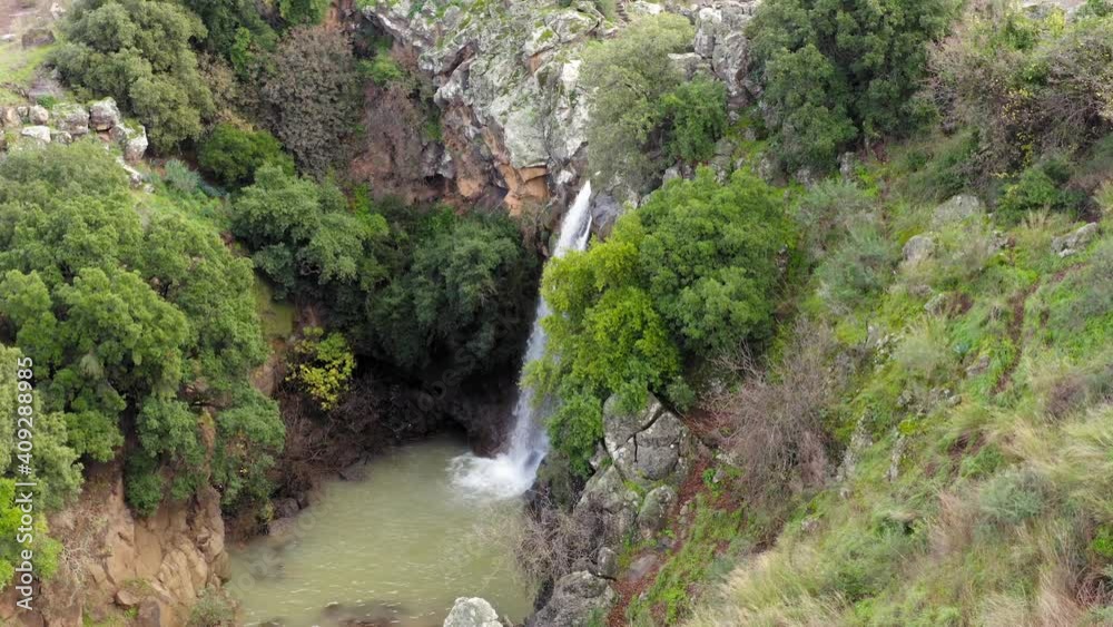 Saar Waterfall with Rain and Snow water plummeting down the stream, surrounded by lush green nature, Aerial view. Saar Waterfall with Rain and Snow water plummeting down the stream, surrounded by lush green nature, Aerial view.