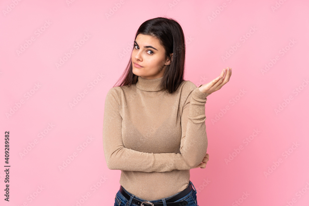Young woman over isolated pink background unhappy for not understand something Young woman over isolated pink background unhappy for not understand something