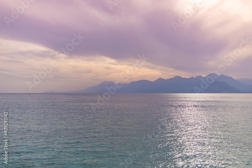 View from port of old city of Antalya to opposite coast Beydajlari mountain range and sea.