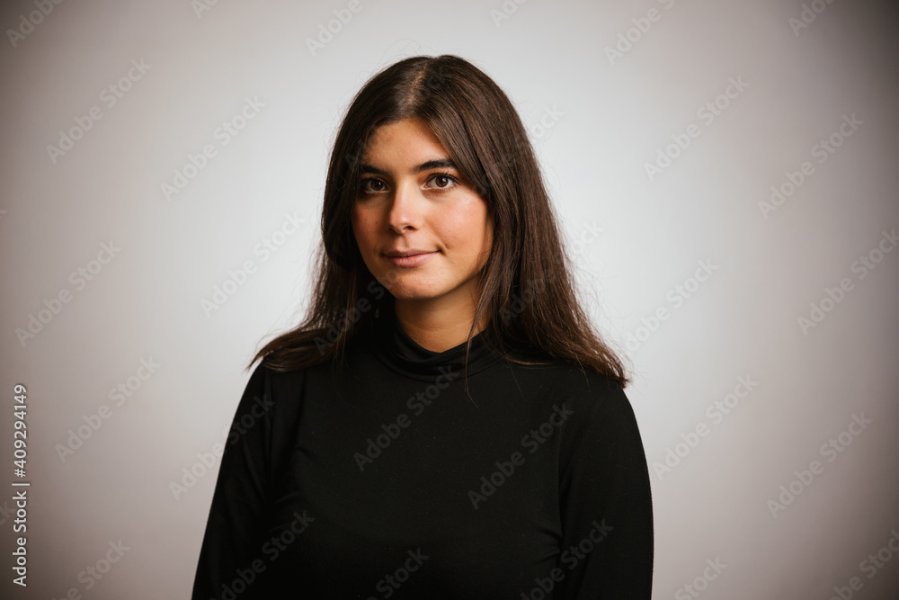 Studio portrait on a white background of a beautiful woman with brown hair Studio portrait on a white background of a beautiful woman with brown hair
