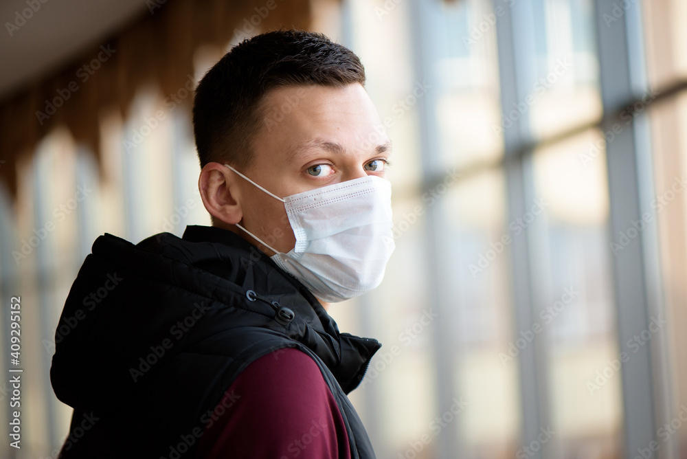 Sick man wearing a face mask in quarantine zone. New coronavirus 2019-nKoV infection or Wuhan coronavirus