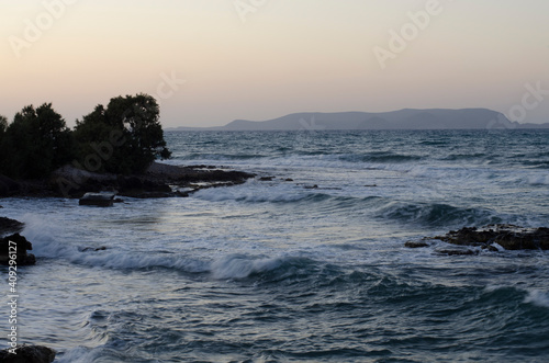 coast and sea in the evening, waves, Gouves, Crete, Greece