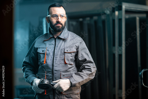 Man working with metal at the workshop photo