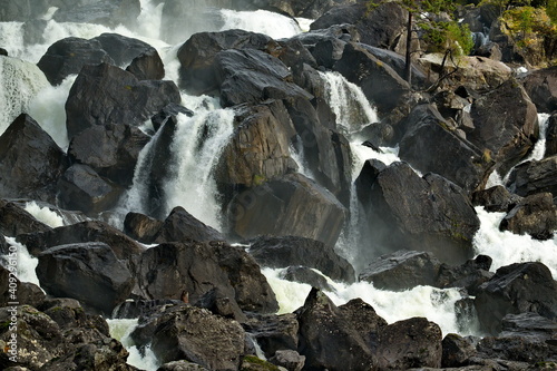 Russia. Mountain Altai. A fragment of the Uchar cascade waterfall on the Chulcha River, the right tributary of the Chulyshman River. photo