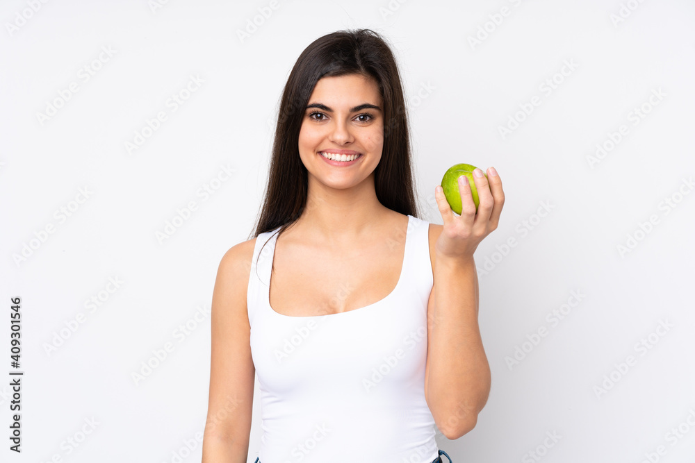 Young woman over isolated white background with an apple Young woman over isolated white background with an apple