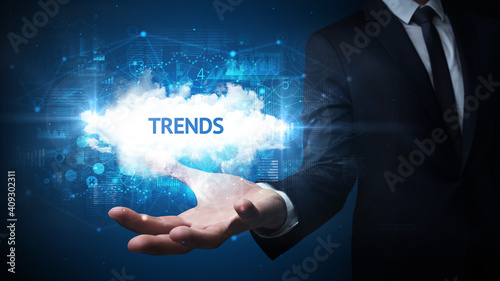 Wallpaper Mural Hand of Businessman holding TRENDS inscription, successful business concept Torontodigital.ca