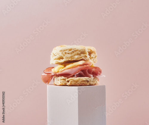 Ham and Cheese Biscuit on Pink Riser with Pink Background
