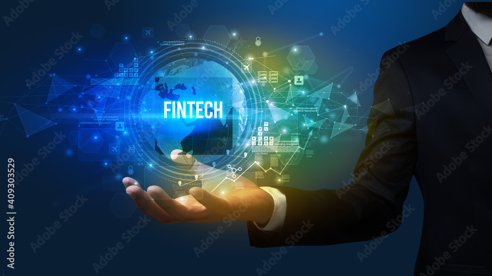 Elegant hand holding FINTECH inscription, digital technology concept Elegant hand holding FINTECH inscription, digital technology concept