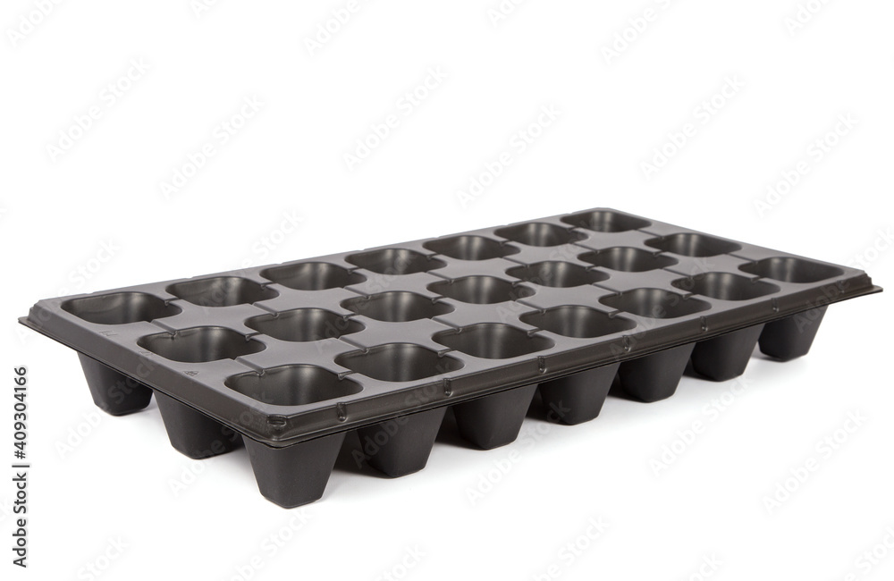 Black cassette for seedlings on a white background. Black cassette for seedlings on a white background.
