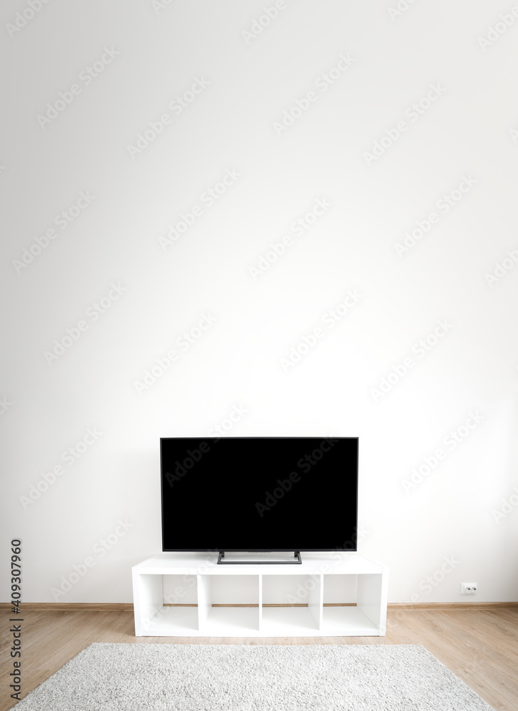 Lcd tv on white shef at modern room interior. Copy space Lcd tv on white shef at modern room interior. Copy space